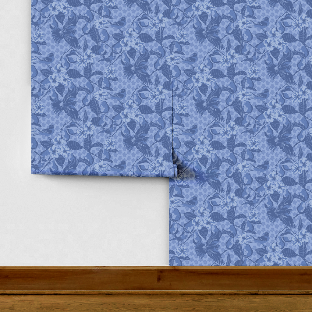 The artwork showcases a vibrant and detailed pattern featuring three orange and black birds set against a backdrop of yellow pears, green leaves, and white blossoms. The birds are depicted in different poses: one perched on a branch, one in mid-flight with wings spread, and another near a pear. The rich colors and intricate details of the feathers, fruits, and flowers create a lively and harmonious composition. The overall style combines naturalistic elements with a decorative, repeating design, highlighting the beauty of nature with emphasis on bold contrasts and vivid hues.